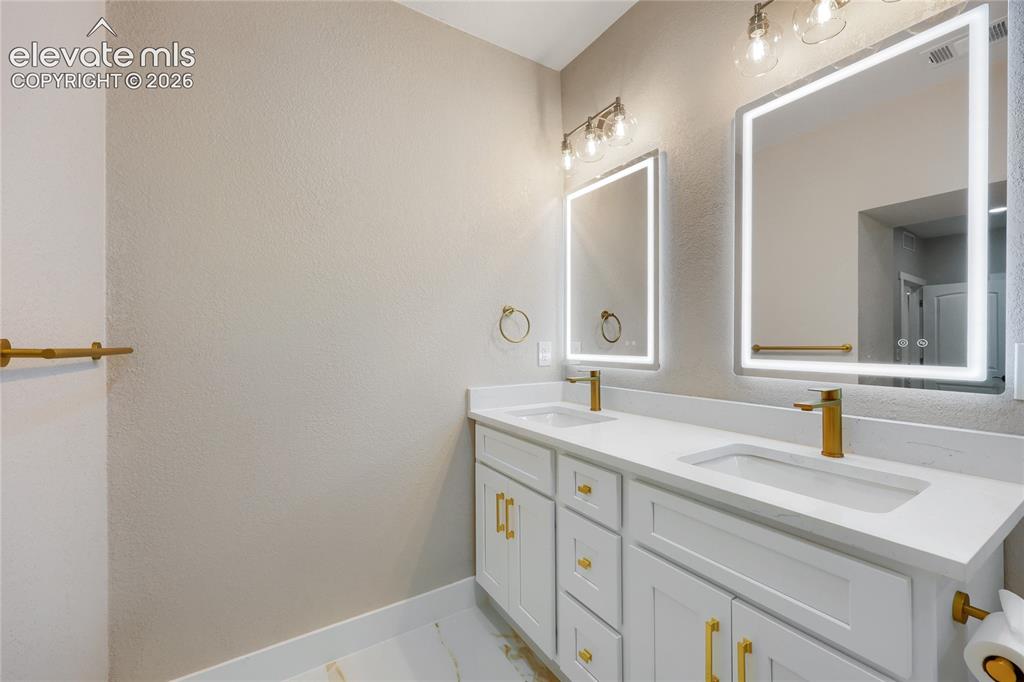 Image 26 of 49: A third view of this beautiful primary ensuite bathroom.