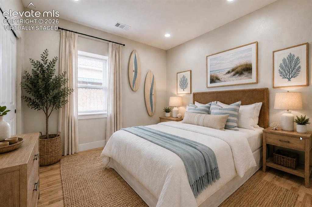 Image 29 of 49: This beautiful second bedroom is virtually staged as a guest room.