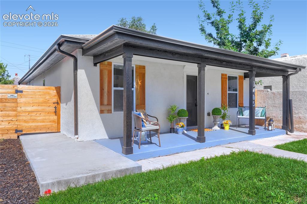 Image 3 of 49: Perfect front porch and lawn! There