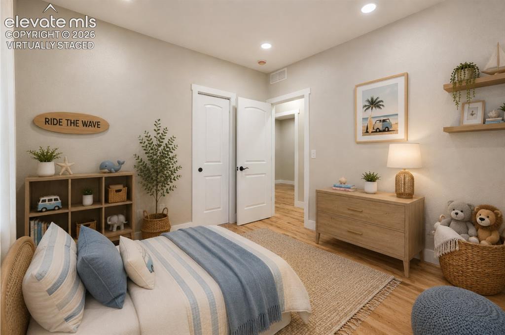 Image 35 of 49: And the same bedroom, but virtually staged. The furniture layout shows the