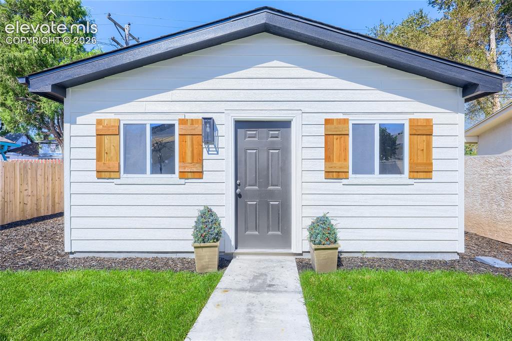 Image 45 of 49: The oversized, 2-car garage, with shutters that match the shutters on the f