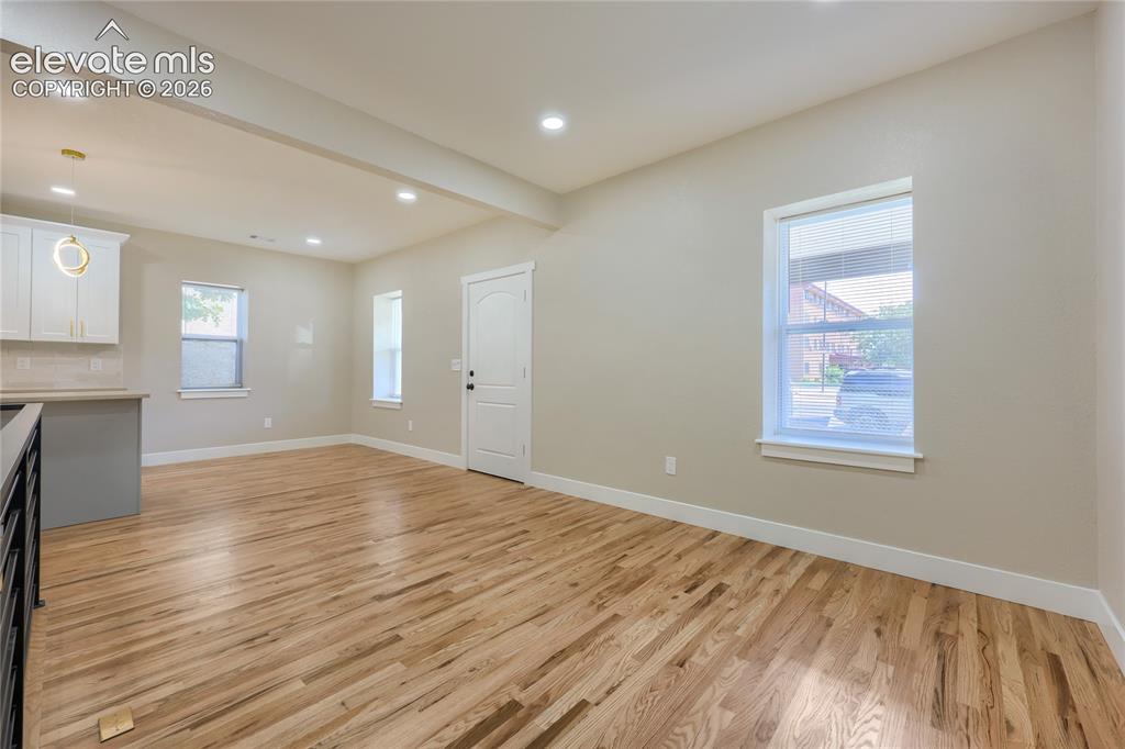 Image 7 of 49: Another great view of the living and dining area, complete with gleaming wo