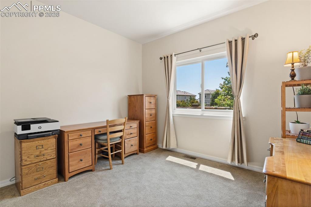 Image 19 of 31: Main level guest bedroom 2 – also makes a great office