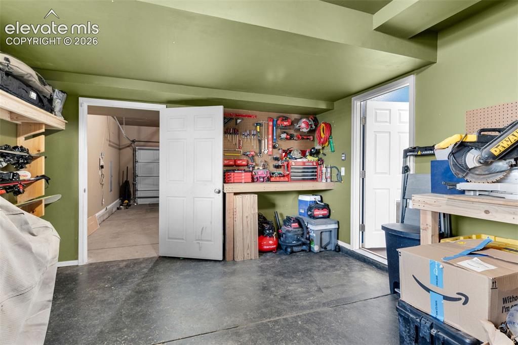 Image 33 of 47: Tandem Garage finished. Great workshop option.