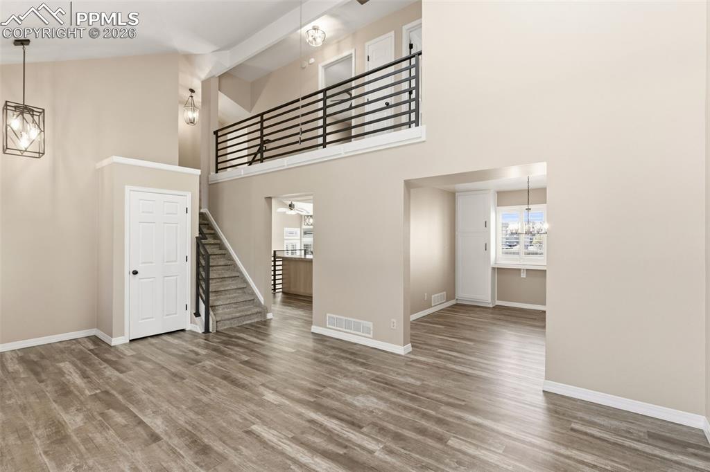 Image 14 of 49: Luxury vinyl plank flooring throughout the main level. 