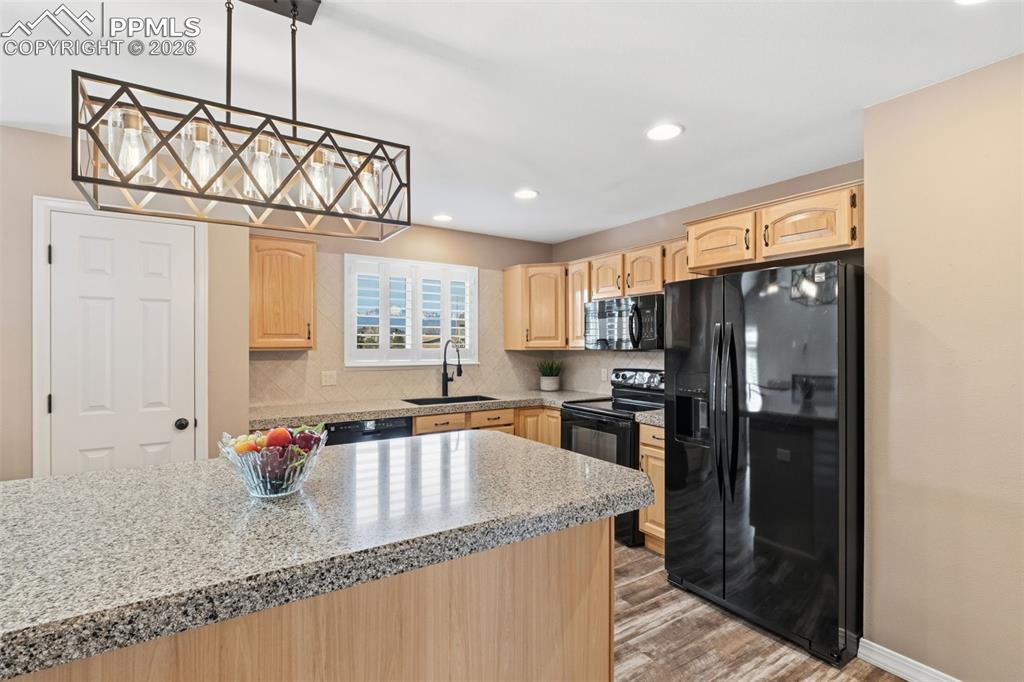 Image 16 of 49: The cabinetry and countertops were all updated. 
