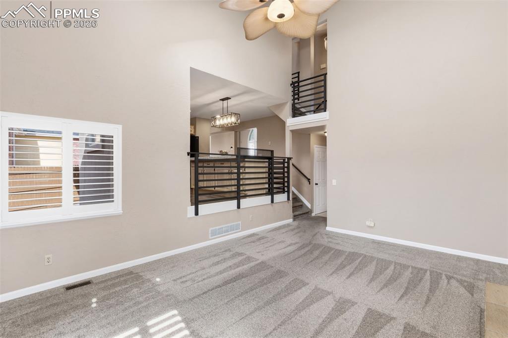 Image 23 of 49: The family room opens to the adjoining kitchen 