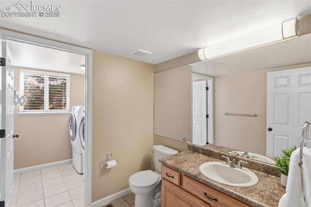 Image 24 of 49: powder room off the family room.