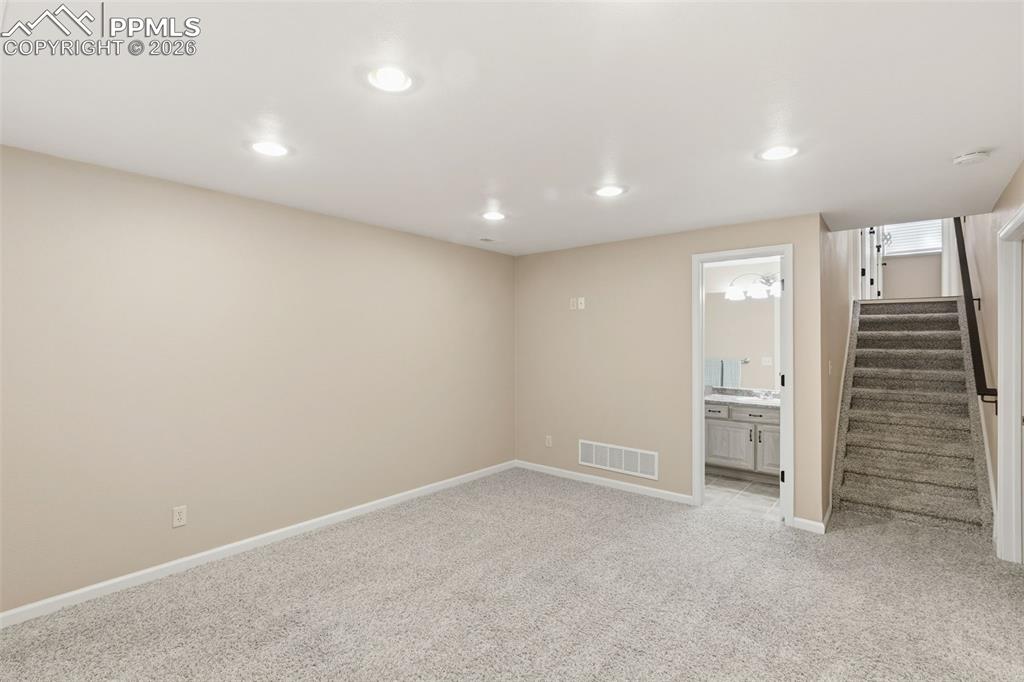 Image 36 of 49: The rec room is a great for kids to get away or can be a great exercise roo