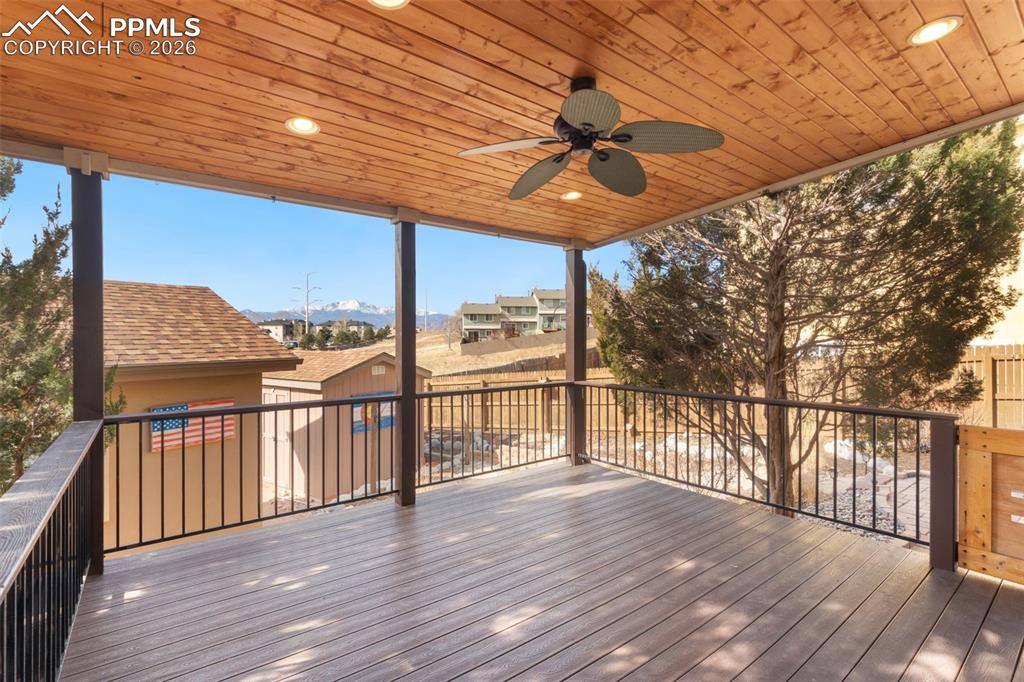 Image 41 of 49: The rear Trex deck is covered with a tongue and groove ceiling and great Pe