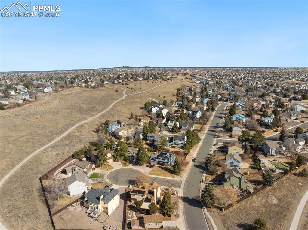 Image 5 of 49: a quiet Cul de sac location backing to a community trail system.