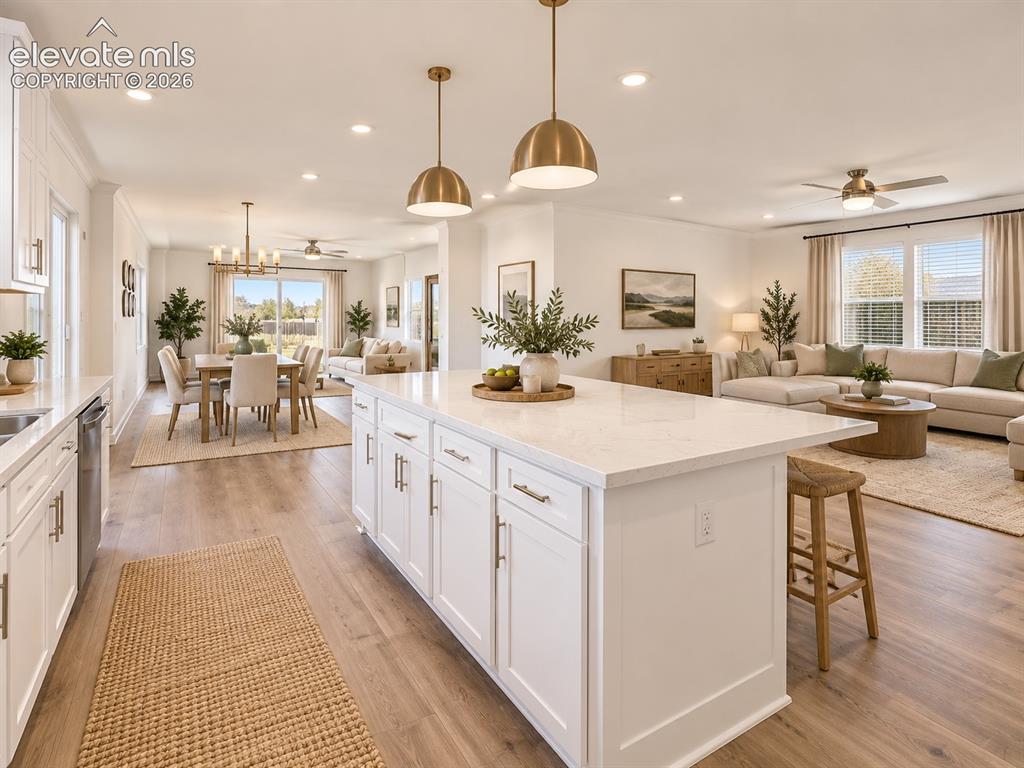 Image 11 of 47: Kitchen, Dining & Living Areas – Wide-angle view showcases the open floor p