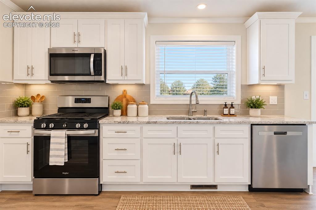 Image 15 of 47: Kitchen – A closer view highlights the stainless steel range, built-in micr