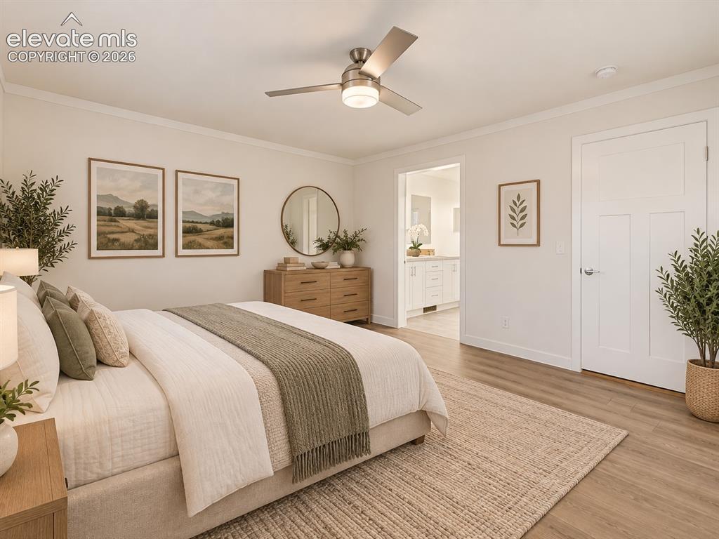 Image 23 of 47: Primary Bedroom – Spacious primary bedroom features wide-plank flooring, a 