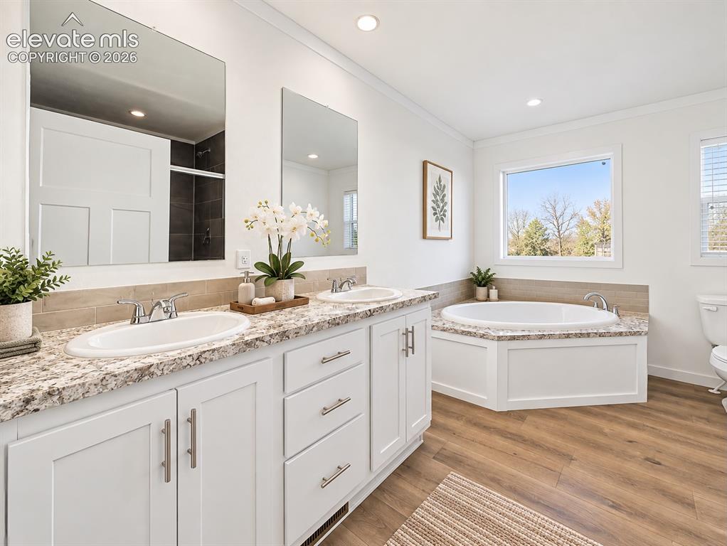 Image 26 of 47: Primary Bathroom – Another view highlights the dual-sink vanity, abundant c