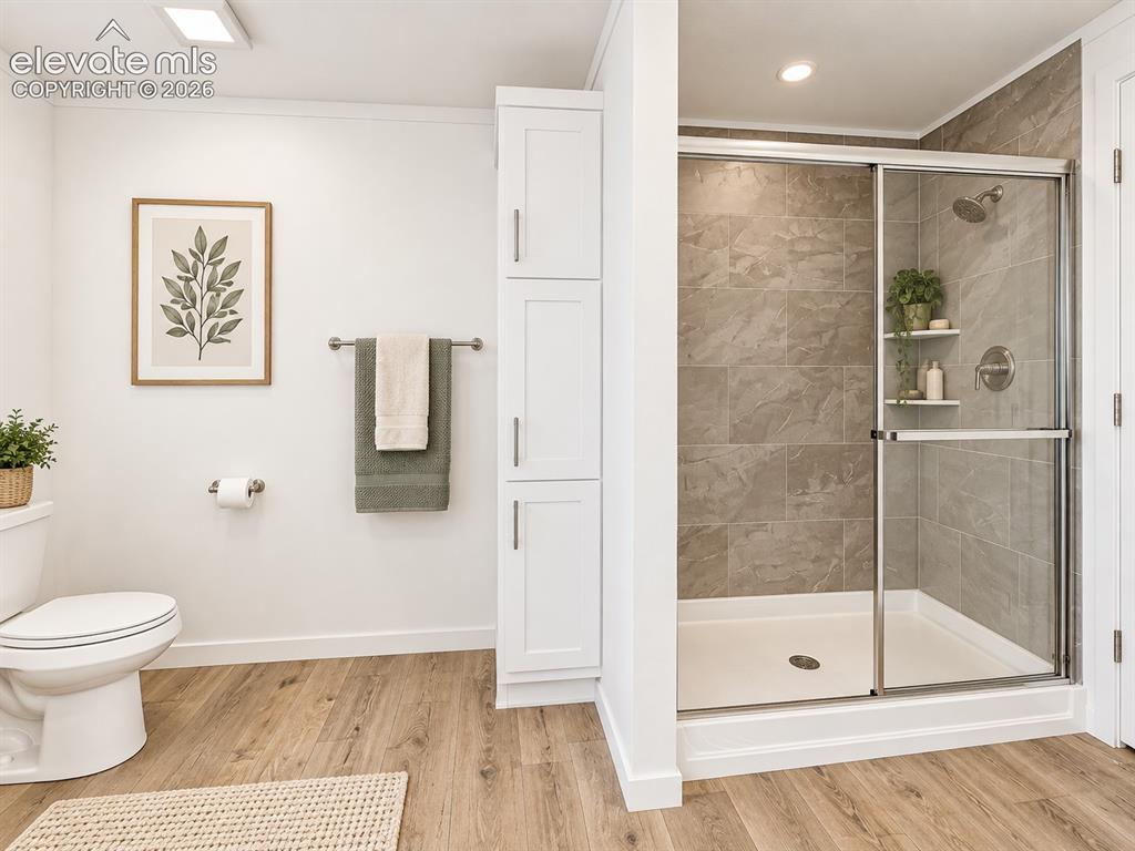 Image 27 of 47: Primary Bathroom – Separate tiled shower with glass enclosure complements t