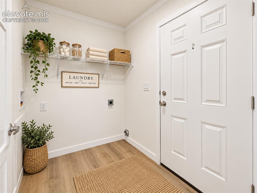 Image 29 of 47: Laundry Room – Dedicated laundry space offers washer and dryer hookups, ove