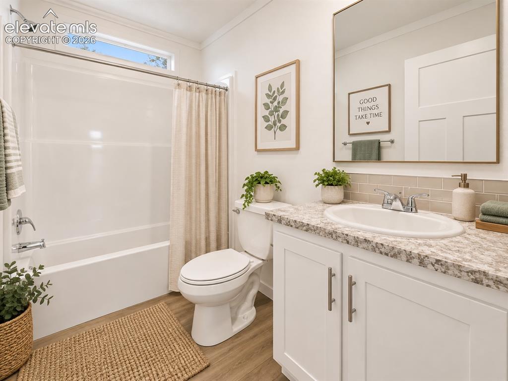 Image 35 of 47: Full Bathroom – Bright full bath features a tub-and-shower combination, sto