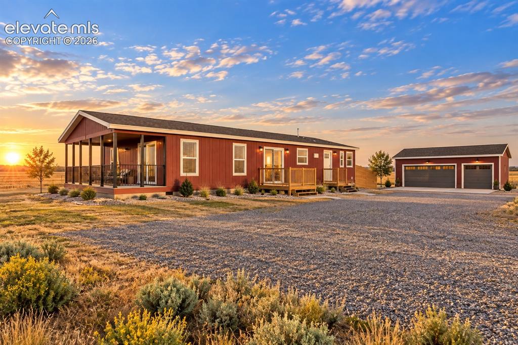 Image 36 of 47: Detached Garage – Detached garage features two separate overhead doors, ext