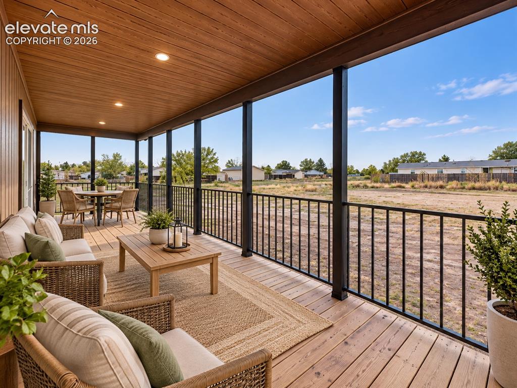 Image 37 of 47: Covered Porch – Expansive covered porch provides abundant space for outdoor