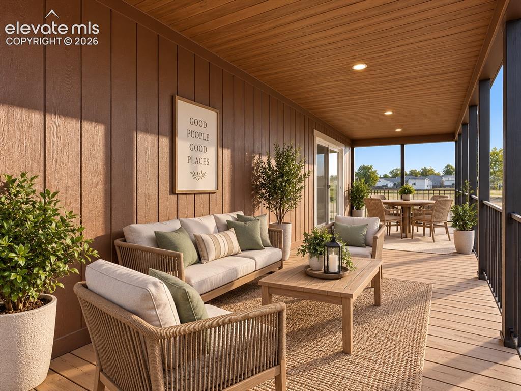Image 38 of 47: Covered Porch – A warm wood-look ceiling and generous covered footprint cre