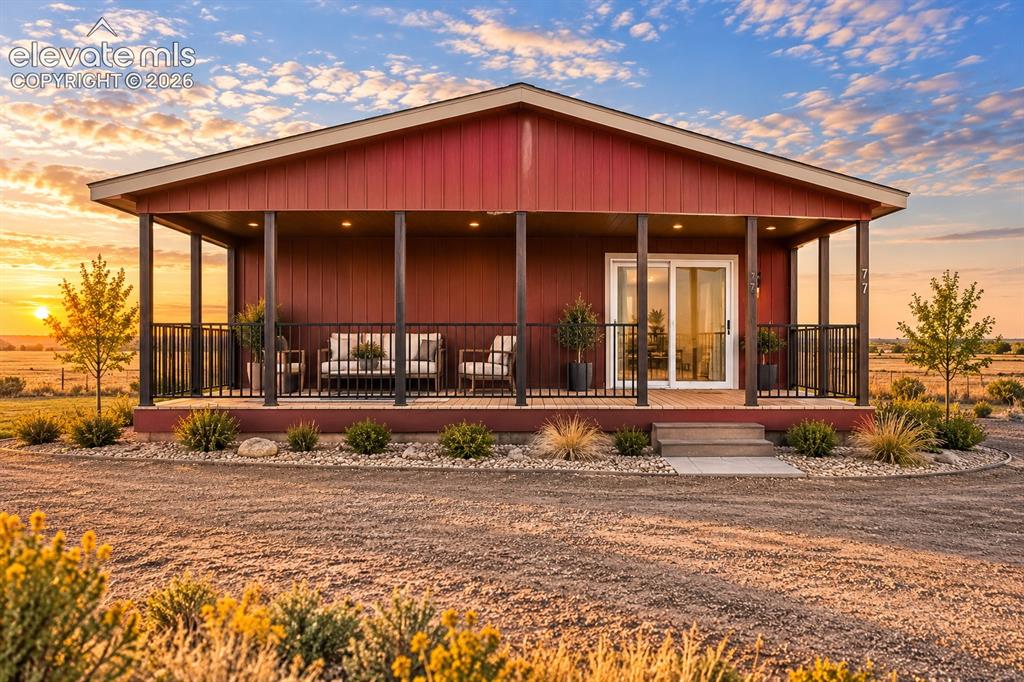 Image 40 of 47: Exterior – Striking sunset view showcases a complete look at the property’s