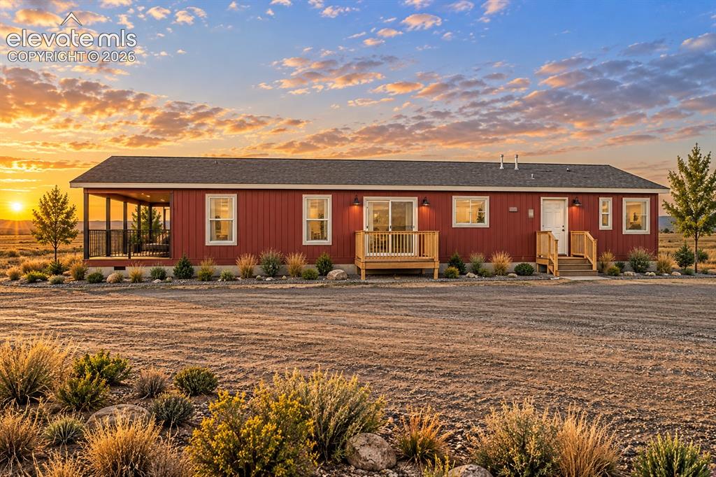 Image 43 of 47: Exterior & Detached Garage – Wide property view captures the home, detached