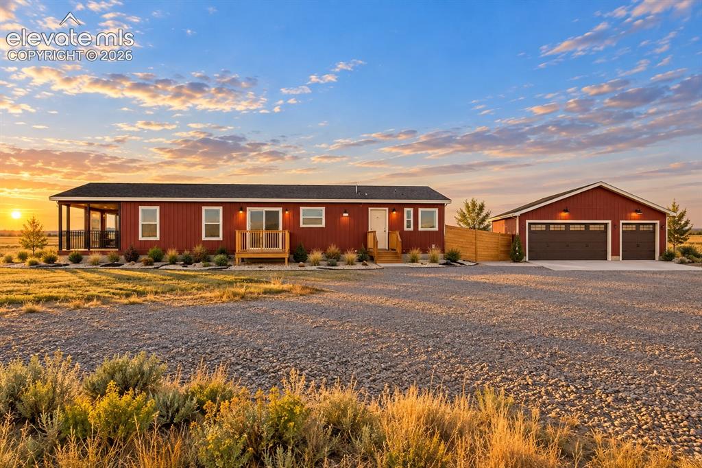 Image 44 of 47: Exterior – Broad exterior view highlights the home’s elongated single-level