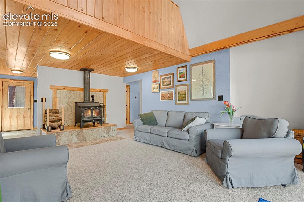 Image 10 of 46: Cozy wood fireplace and hearth