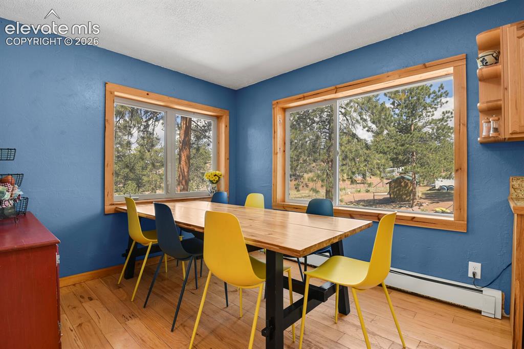 Image 12 of 46: Eat-in kitchen dining area with two corner windows