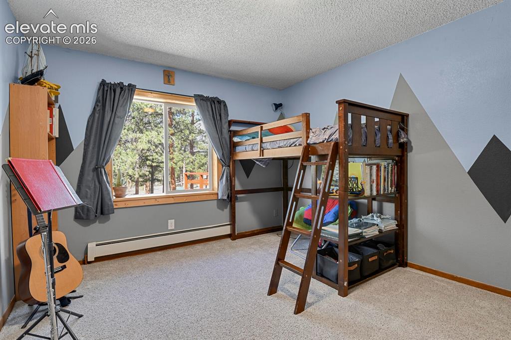 Image 19 of 46: Main level secondary bedroom