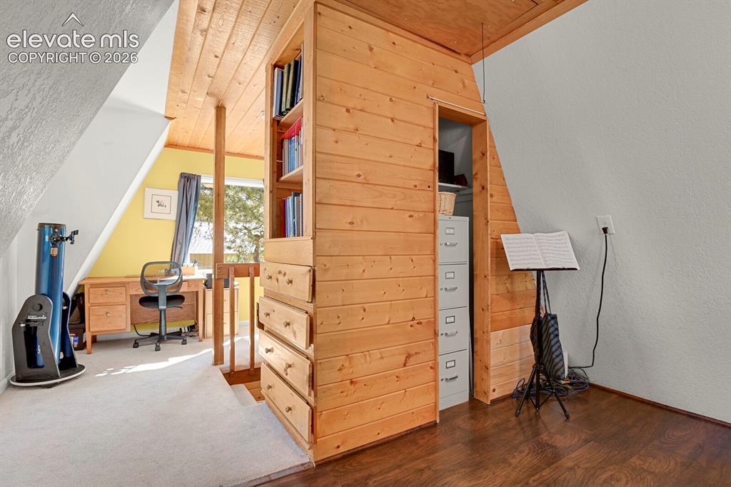 Image 22 of 46: Loft bedroom offers built-in drawers and closet storage; options for many u