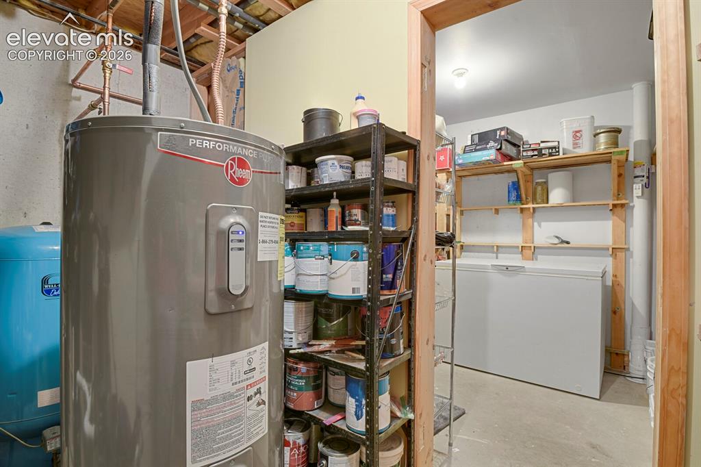 Image 32 of 46: Lower level utility room with additional storage