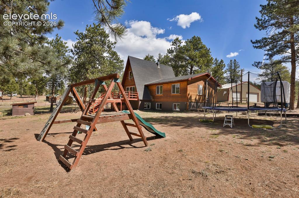 Image 33 of 46: Fenced in backyard area for dogs, kids, and play