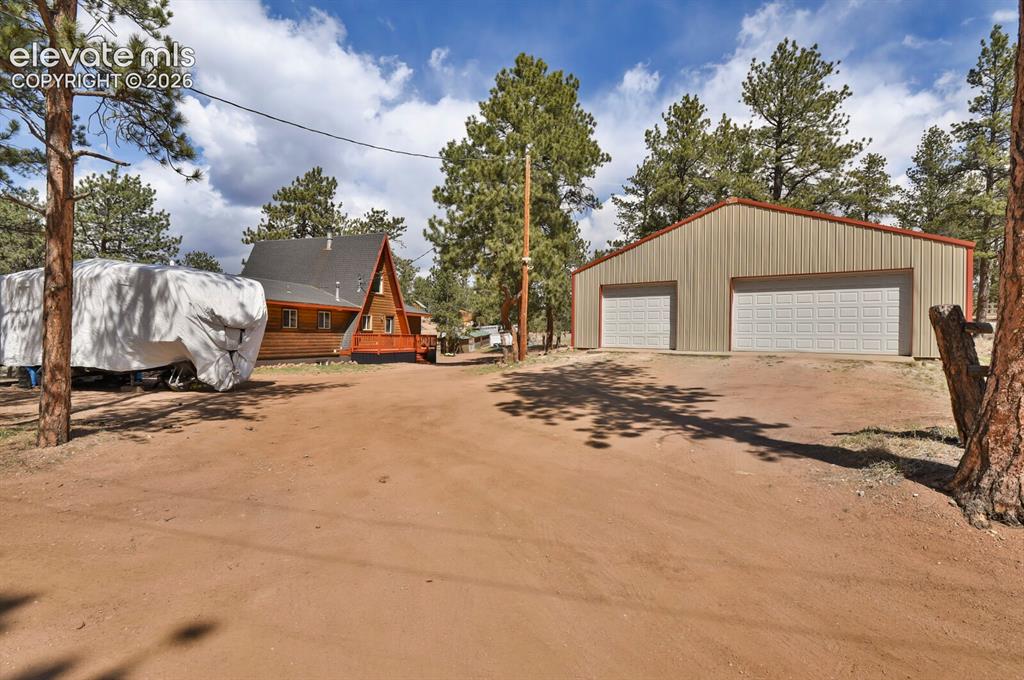 Image 37 of 46: Detached, insulated 40x40 workshop/garage; circular driveway with room to s