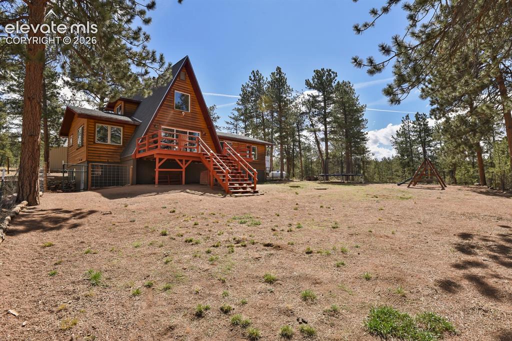 Image 6 of 46: Back of home from fenced area for dogs, kids, play