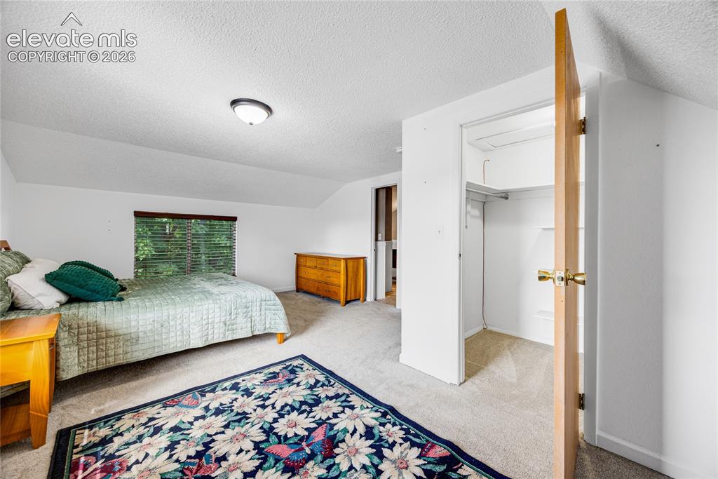 Image 11 of 24: Large walk-in closet in the primary bedroom