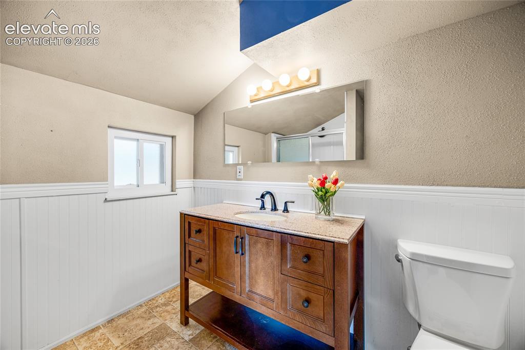Image 12 of 24: Walk-in shower in primary bathroom