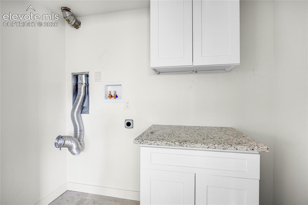 Image 18 of 24: Basement laundry
