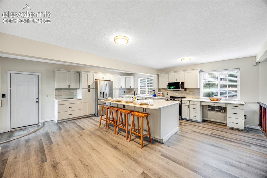 Image 6 of 24: Large eat in kitchen