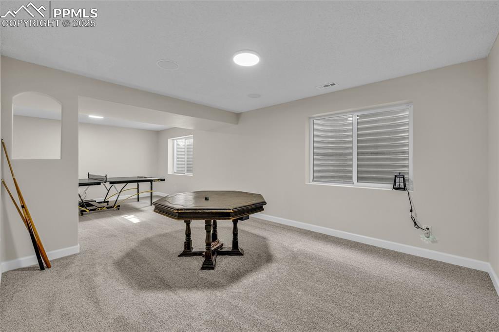 Image 24 of 40: Rec room with carpet and baseboards