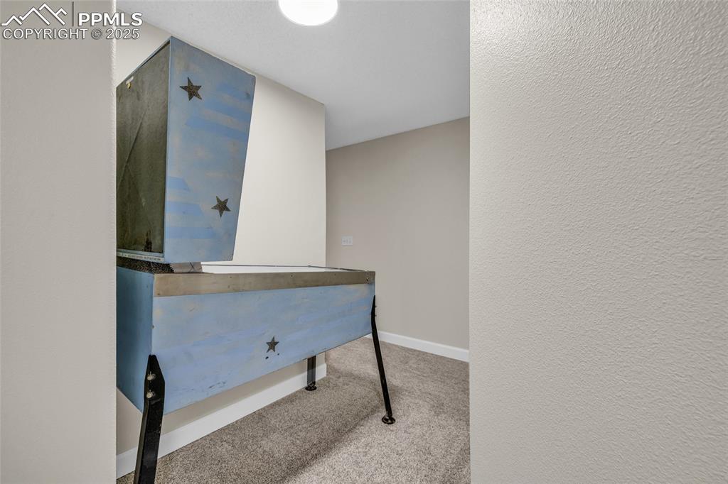 Image 31 of 40: Home office featuring light colored carpet and baseboards