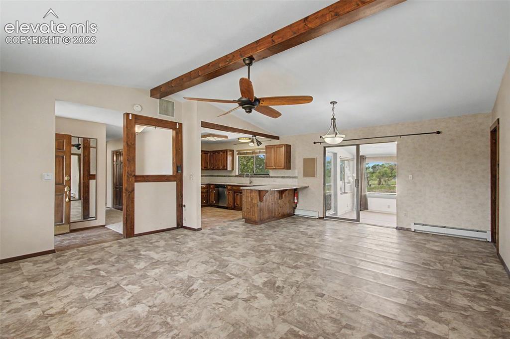 Image 19 of 50: Large great room is perfect for a living room area and a dining area, with