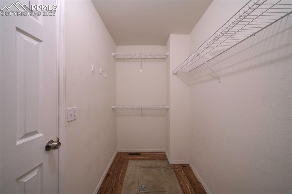 Image 18 of 30: Cedar lined walk in closet
