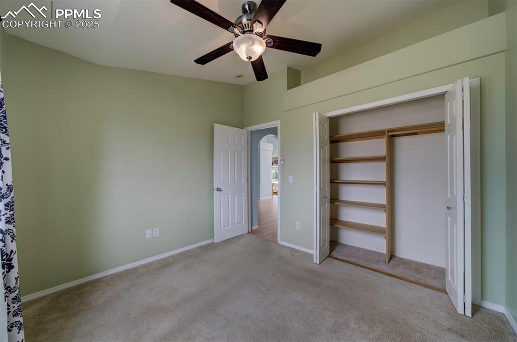 Image 20 of 30: 2nd bedroom, carpet, ceiling fan