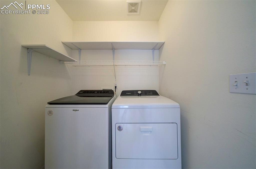 Image 23 of 30: Washer and dryer, shelves