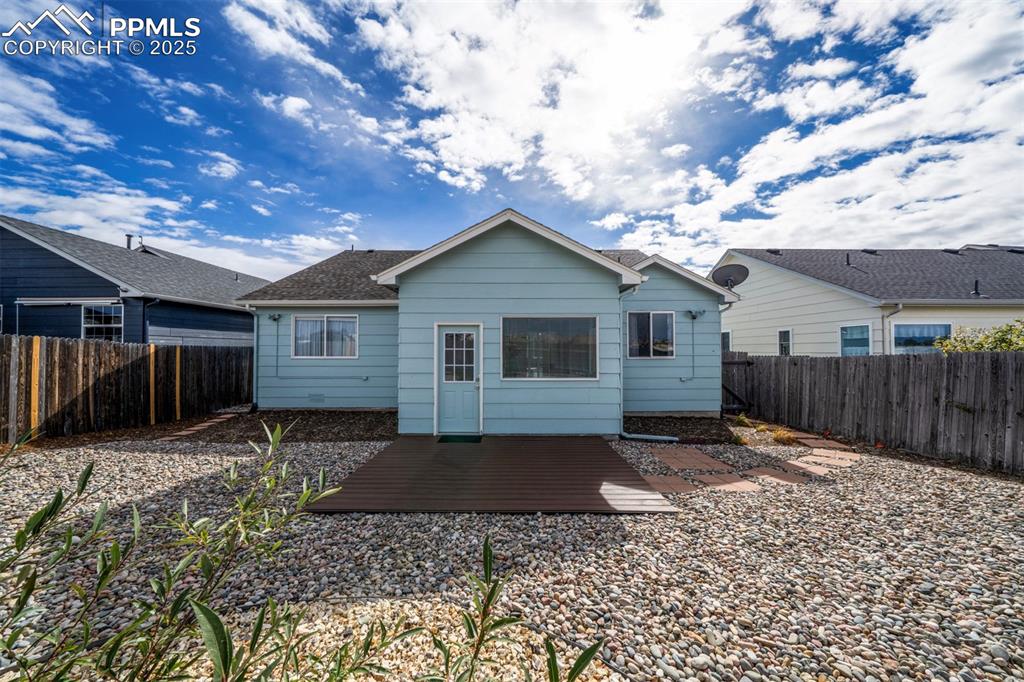 Image 26 of 30: Back of property featuring a fenced backyard