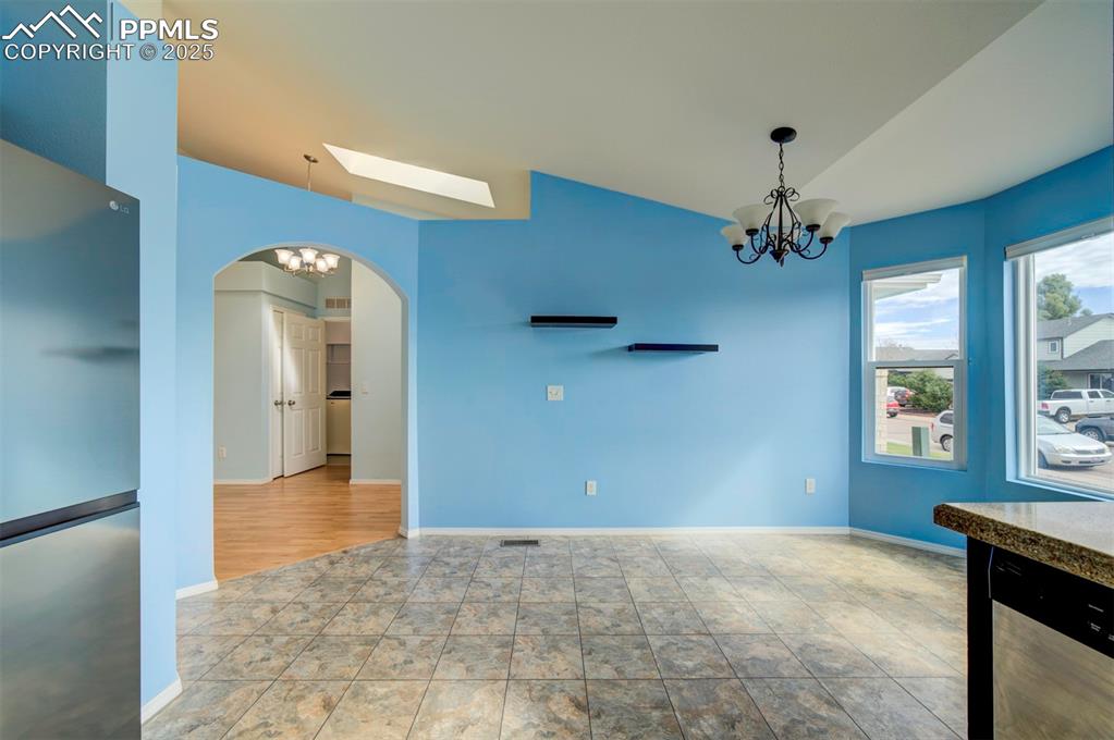 Image 9 of 30: Stainless steel appliances, granite counter tops, dark brown cabinets, pant