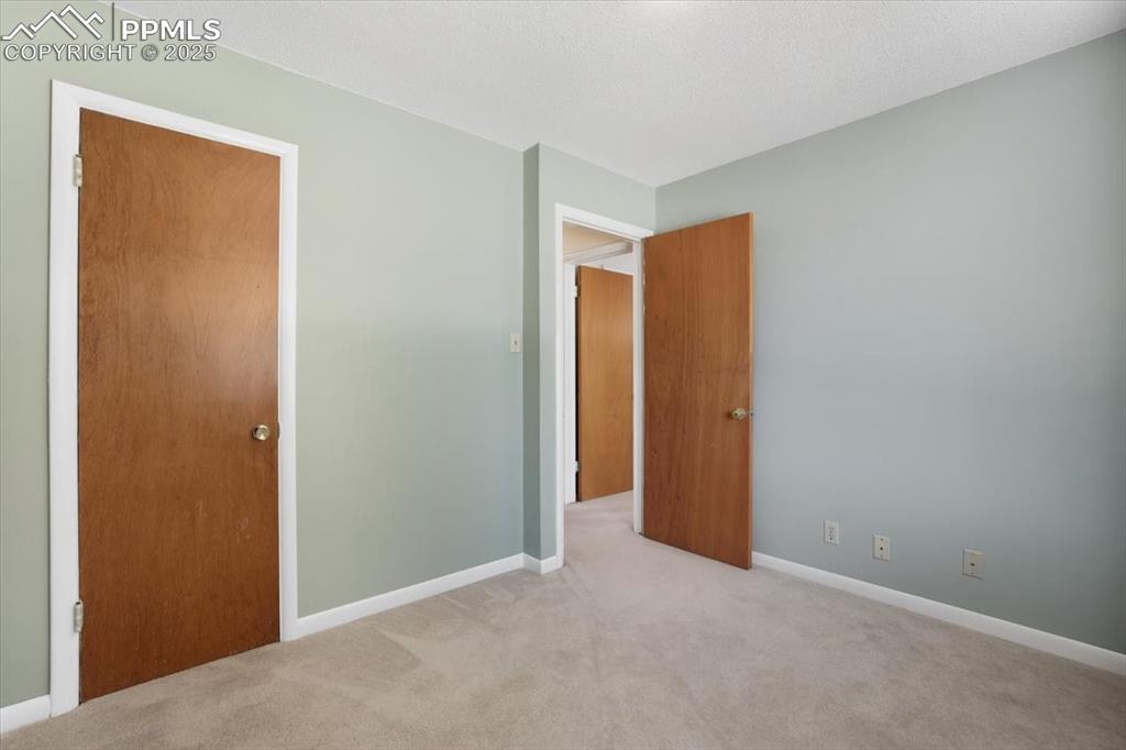 Image 11 of 30: Unfurnished bedroom featuring carpet floors and baseboards