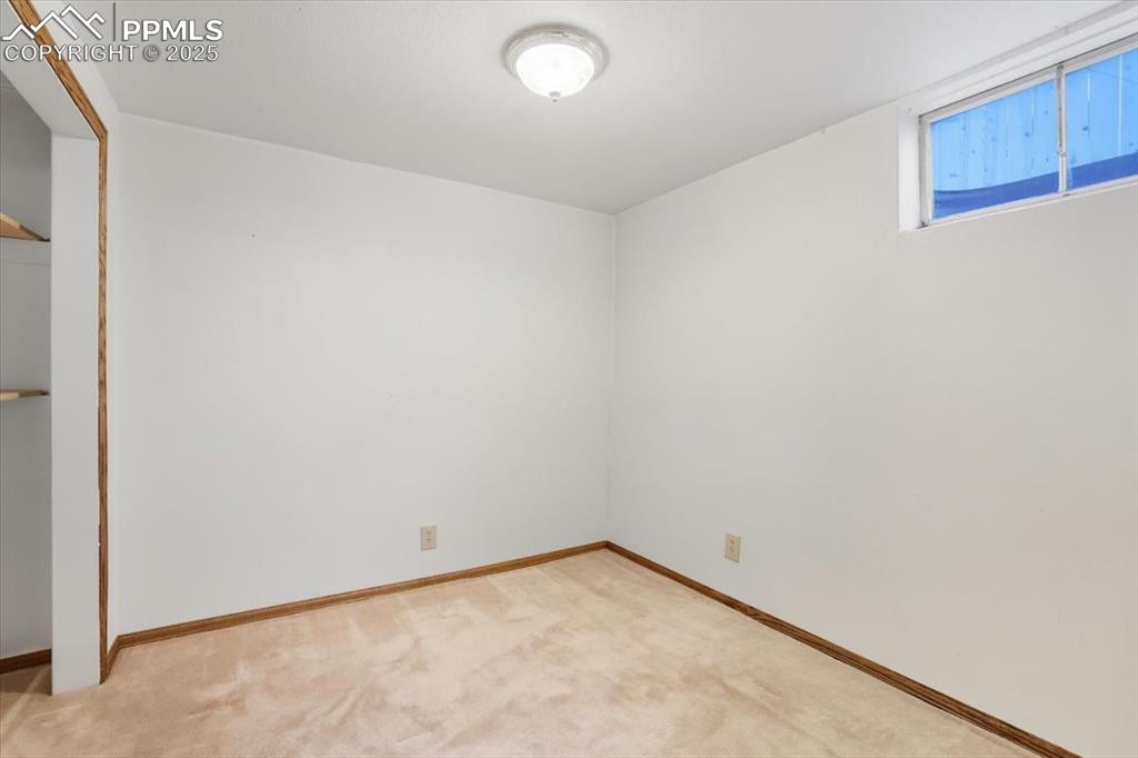 Image 18 of 30: Unfurnished bedroom with a closet and light colored carpet